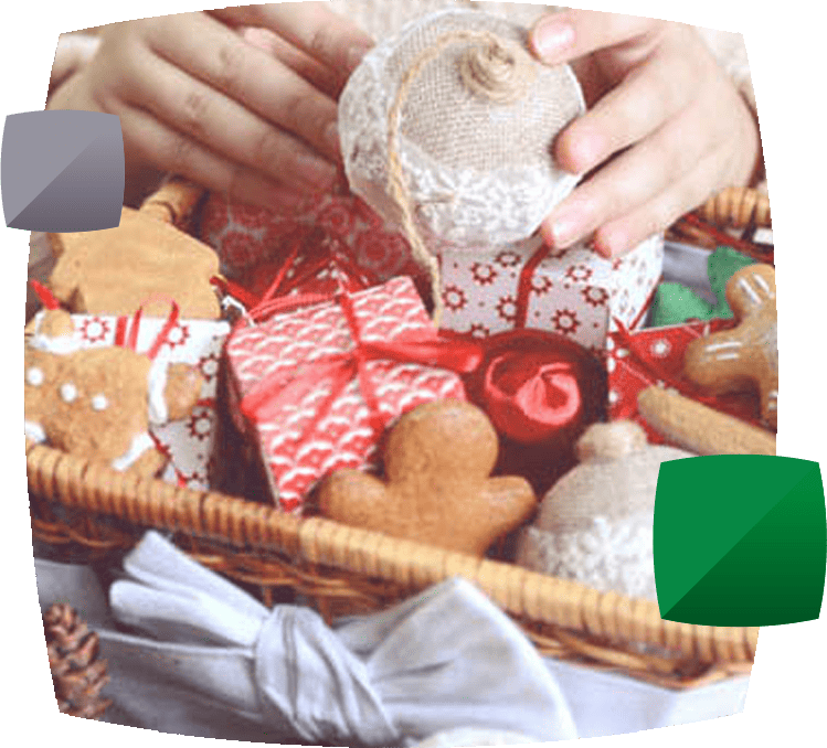 Hands holding Christmas gift hamper