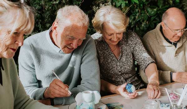 Group of older people doing crafts