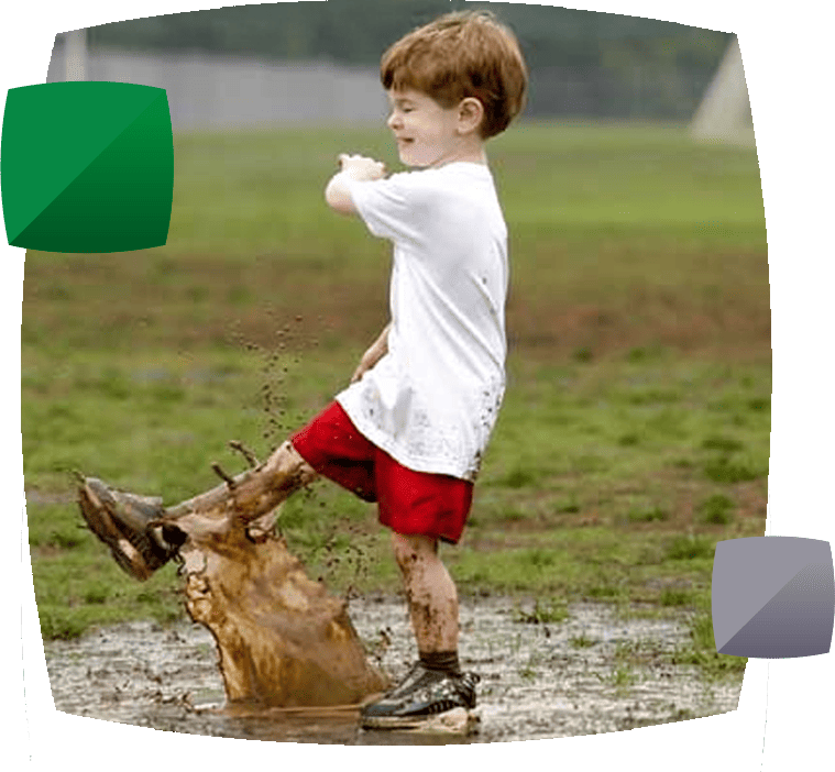 Child splashing in puddle