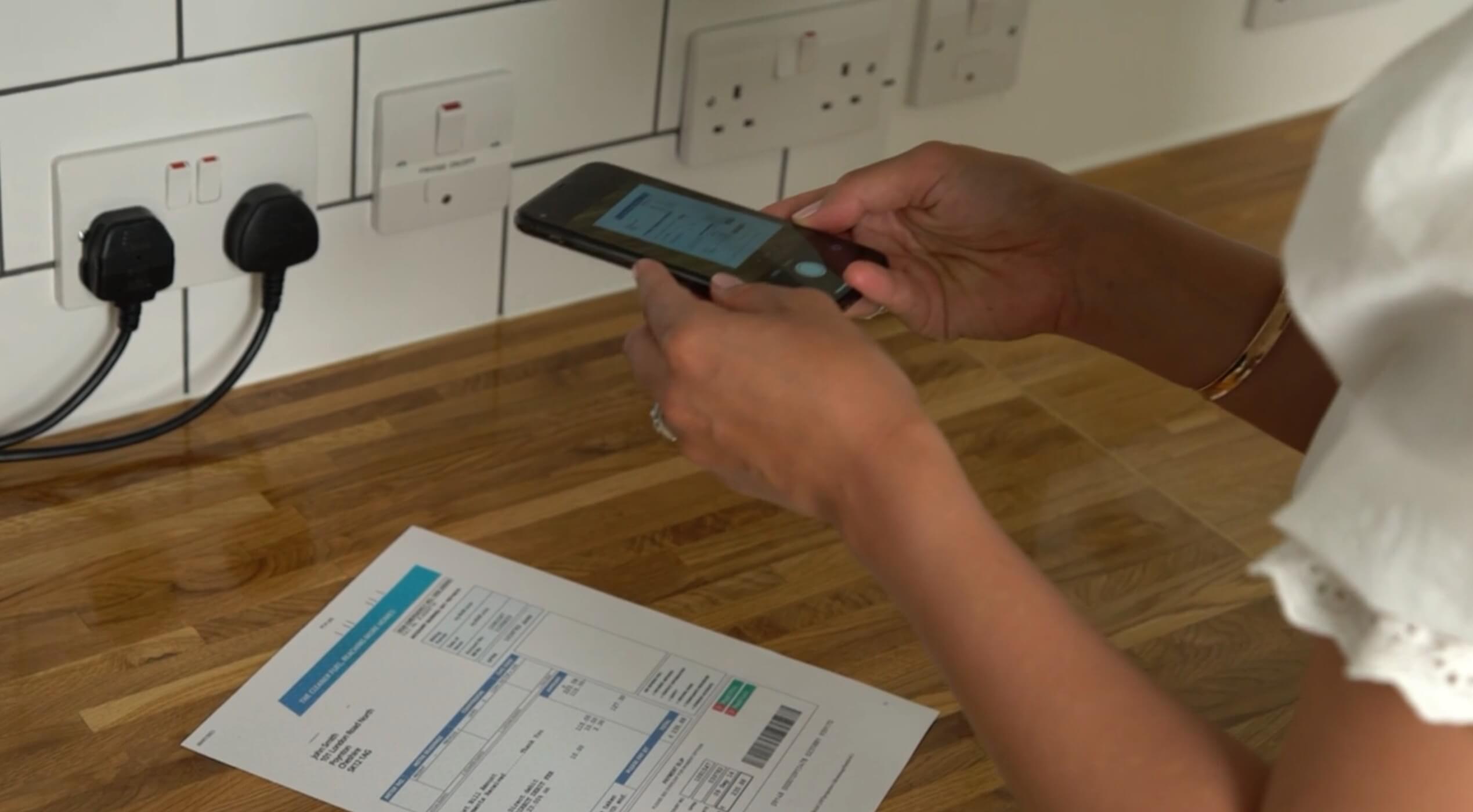 Person taking a picture of proof of address