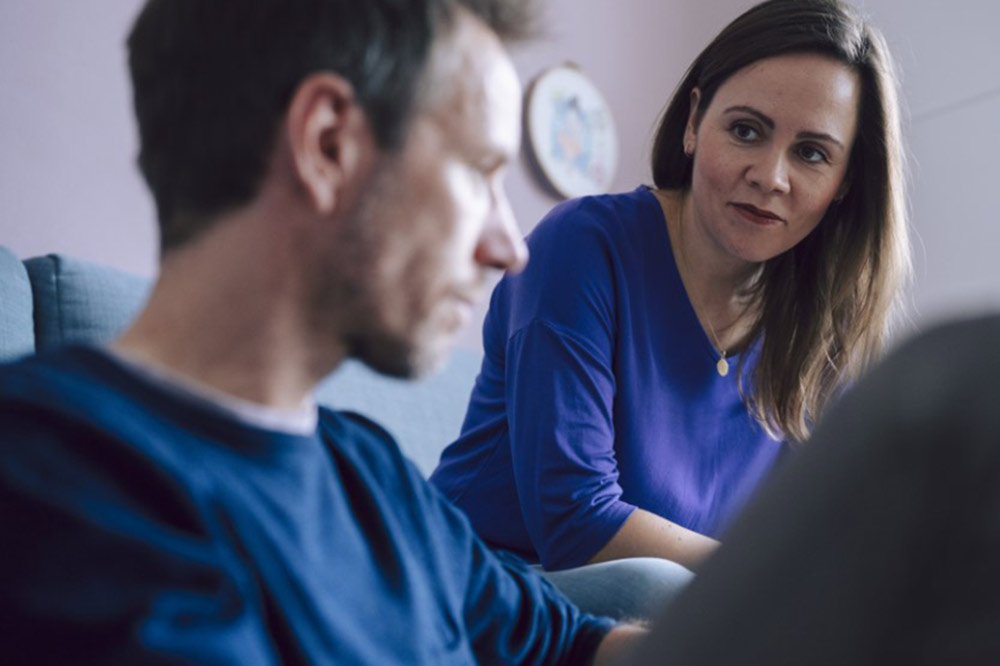 Man and woman talking earnestly