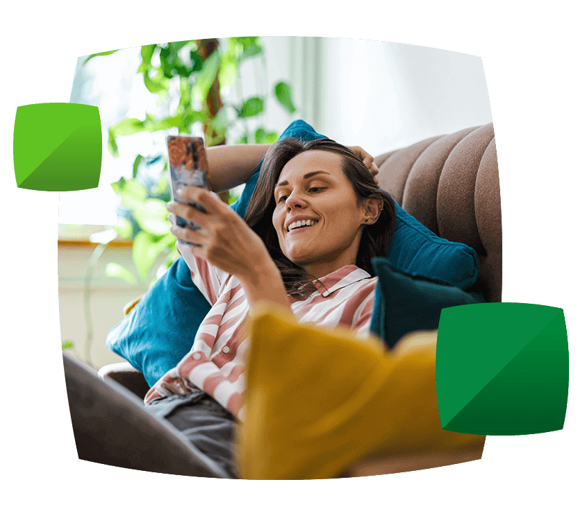 Woman happily browsing her phone