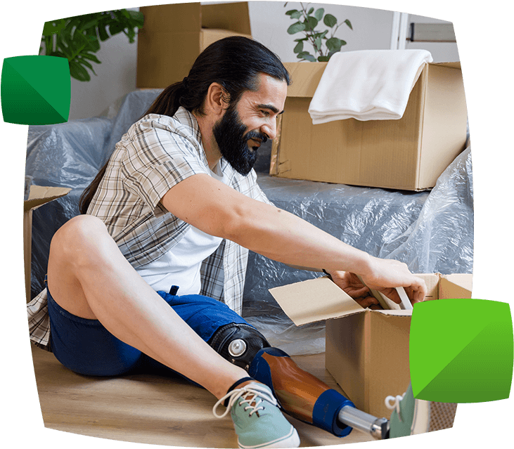 Man opening boxes in new home