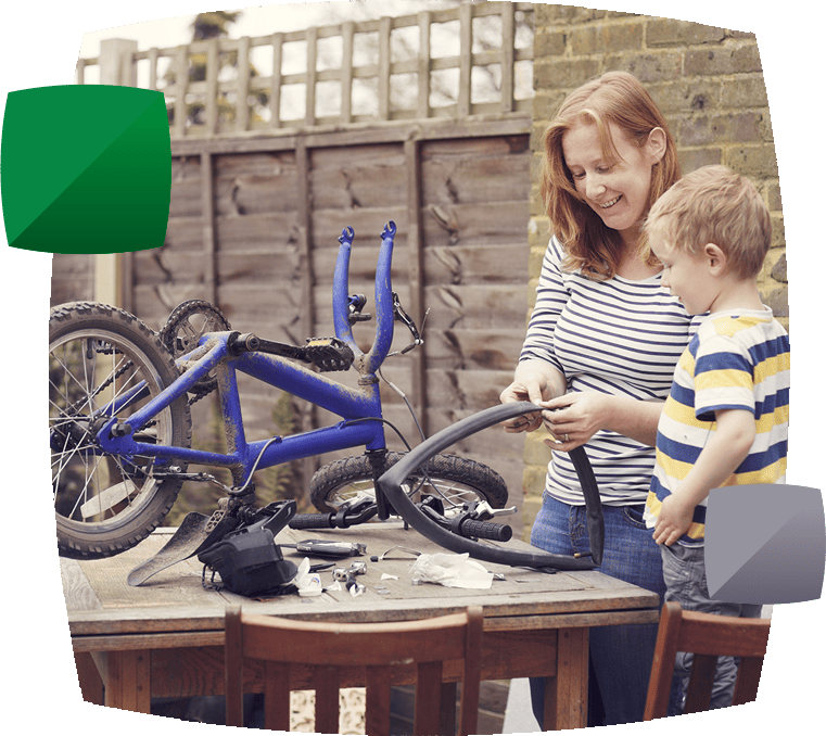 Mother and son fixing bicycle