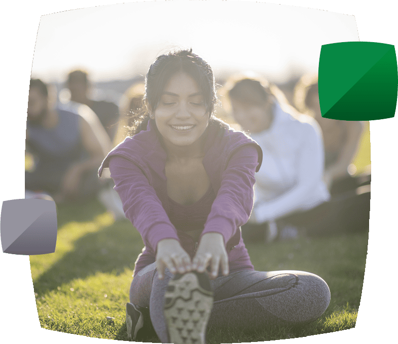 People doing yoga in the park