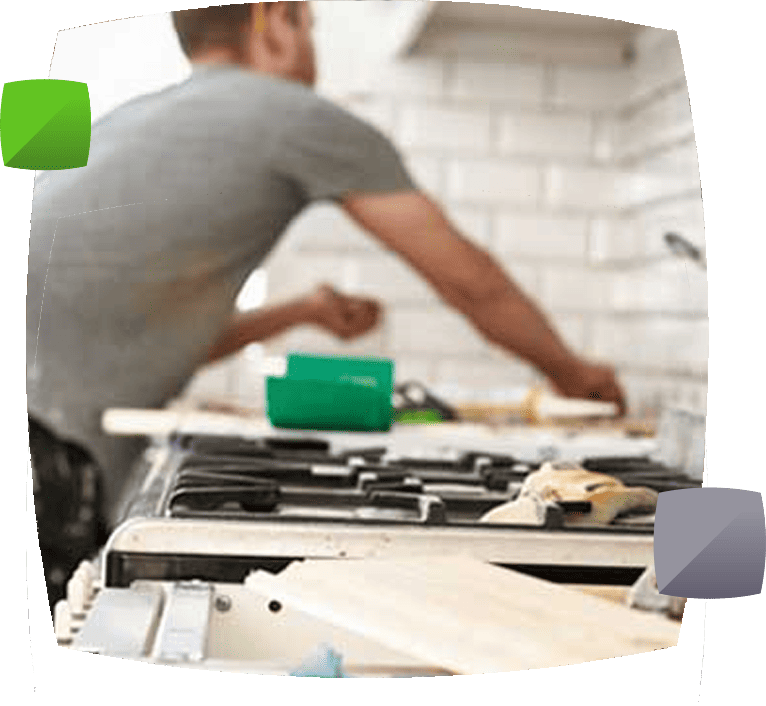 person tiling kitchen