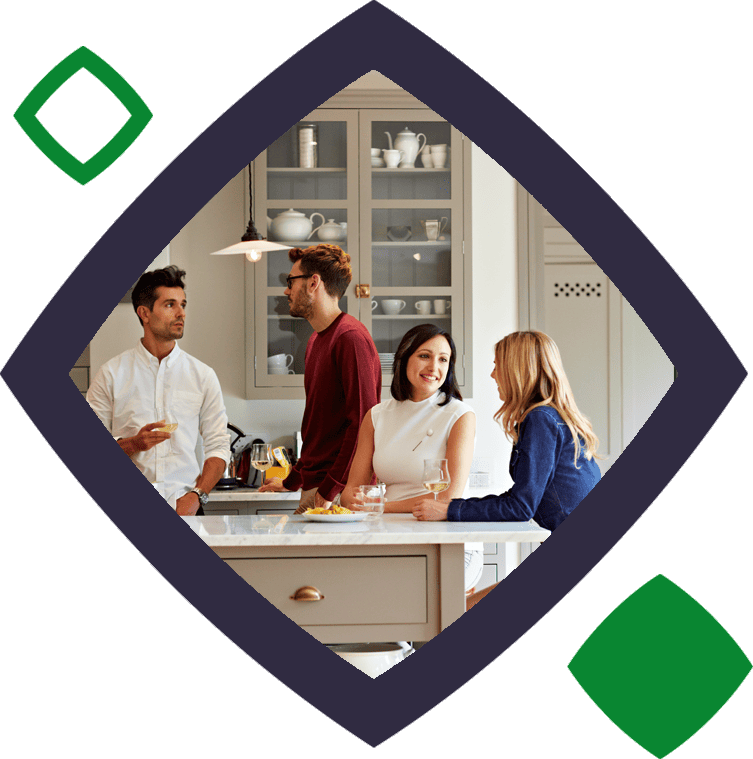 Four friends drinking in a kitchen in squircle
