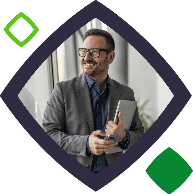 Man smiling holding tablet - in squircle
